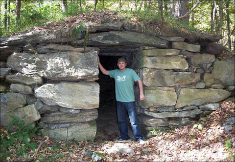 Tim Binnall at the entrance to an ancient mound in Northeast America. Tim Binnall at the entrance to an ancient mound in Northeast America.