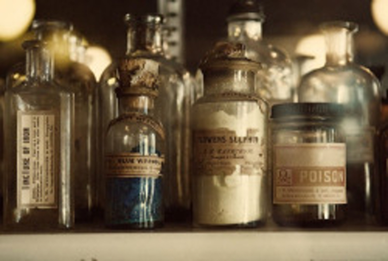 A pleasant photo of some antique labeled bottles.