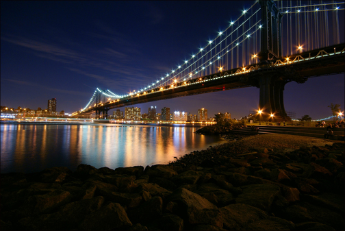 Nighttime view of the Manhattan Bridge.